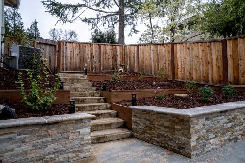 Elevate Your Outdoor Space with Stonework and Soft Lighting